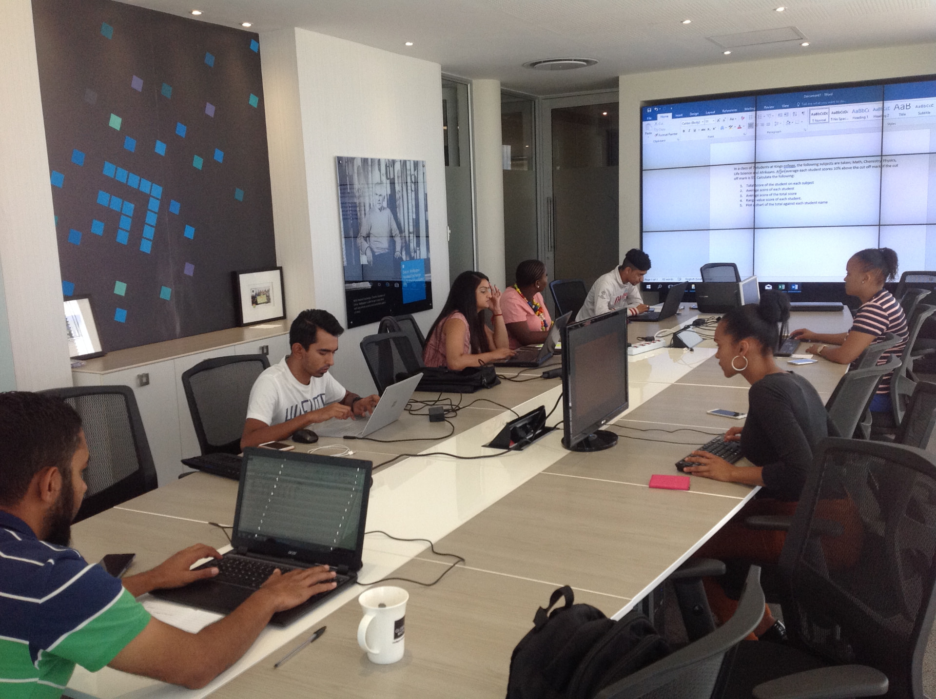 Participants working on laptops during one of Daniel Cole's training sessions