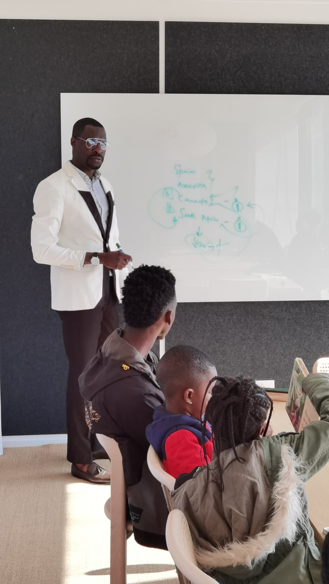 Daniel Cole leading a classroom session with young participants